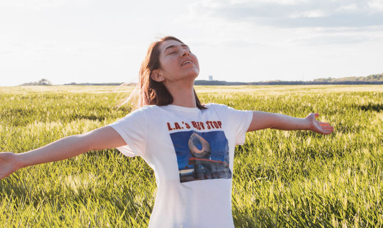 lady enjoying grass fields